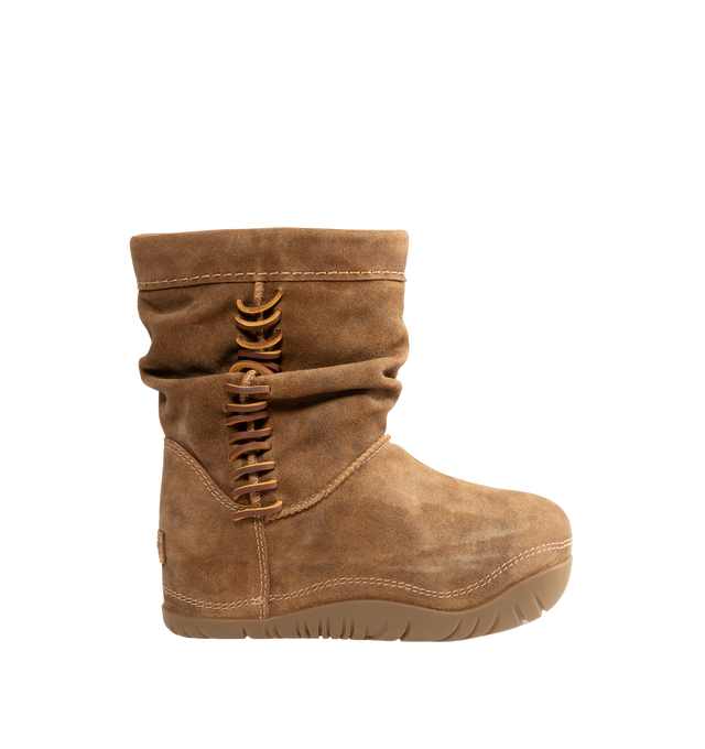 Image 1 of 4 - BROWN - UGG women's Bucked boot with a soft suede upper with an elevated, worn-in feel and a leather whipstitch detail, signature sheepskin lining and cushy rubber platform. Features sugarcane EVA midsole, molded rubber outsole and UGG Logo, heat-embossed. 