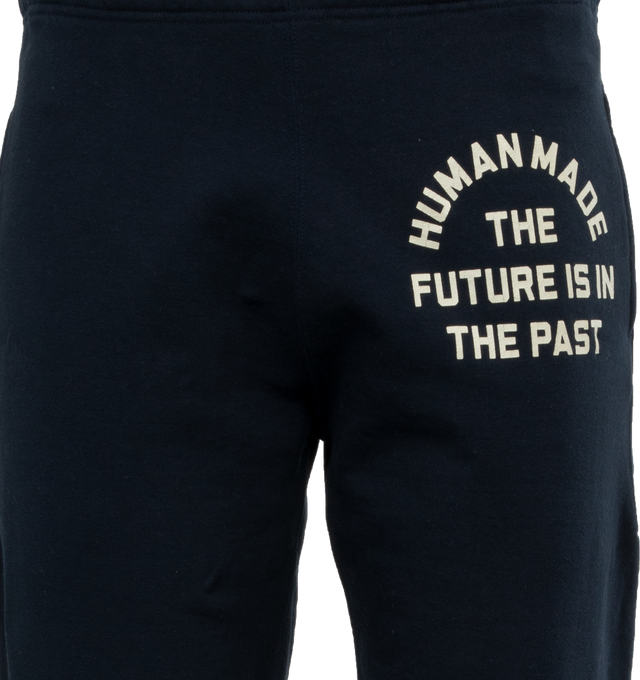 Image 4 of 4 - NAVY - HUMAN MADE Sweatpant featuring elastic waist and hems, side pockets, one back patch pocket and branding on leg. 100% cotton. 