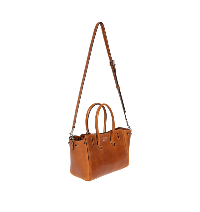 Image 2 of 3 - BROWN - BALENCIAGA Bel Air Carry All Bag Mini in cowboy vegetable tanned lambskin and aged-silver hardware featuring two handles with one handle clip, adjustable and removable strap, shoulder, crossbody and hand carry, Balenciaga Paris logo debossed with foil at back, removable cloche cls with two split rings, side snaps, turn lock closure, logo engraved on the closure system, wide front pocket, 1 main compartment, 2 inner zipped pockets and nappa lambskin bonded lining. Lambskin. Made in Ita 