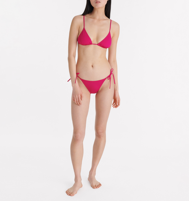 Image 3 of 6 -  PINK - ERES Malou Thin Bikini Brief Bottoms featuring side ties. Main: 84% Polyamid, 16% Spandex. Second: 68% Polyamid, 32% Spandex. Made in France. 