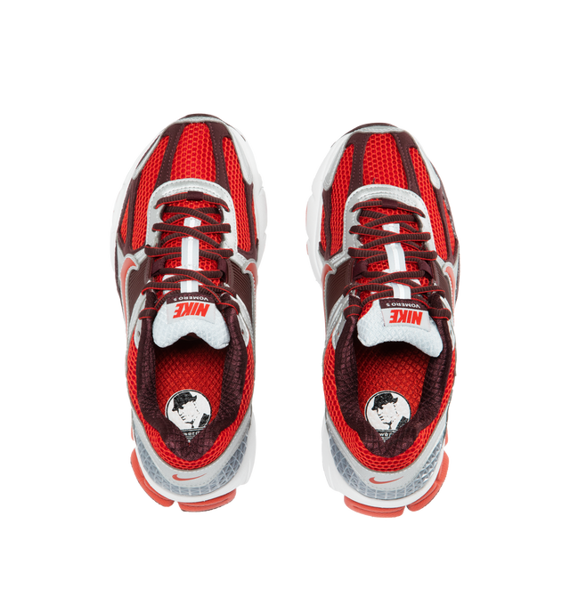 RED - NIKE Vomero 5 featuring leather on upper, mesh panels and ventilation ports on heel, Zoom Air cushioning, plastic caging on side, rubber outsole and reflective details. 