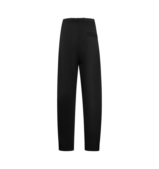 Image 2 of 3 - BLACK - Maison Mihara Yasuhiro Men's Amateur Sewn Track Pants feature an elastic waistband, signature embroidered logo detailing, side striped trim, side pockets, and a back pocket for a sporty yet elevated look. These designer track pants combine everyday comfort with the brand's contemporary aesthetic, making them a versatile choice for casual and streetwear styling. Material: 100% Polyester. 