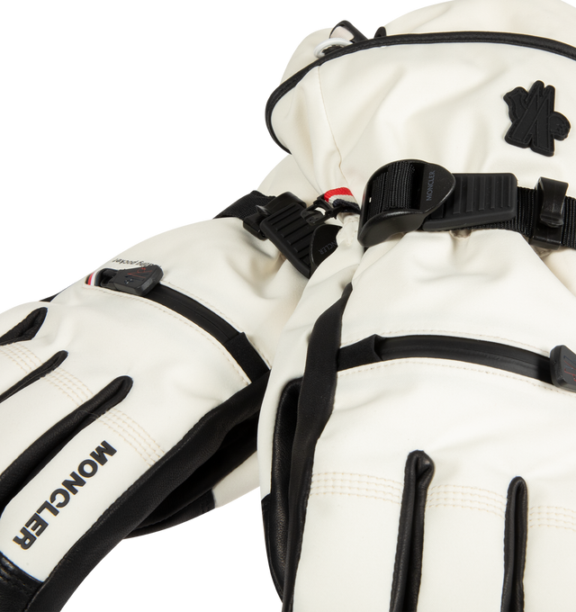 Image 2 of 3 - WHITE - MONCLER GRENOBLE Padded Gloves featuring four-way stretch 2L technical polyester, nylon lining, padded, zipper closure, inner pocket, adjustable cuffs and logo detail. 87% polyester, 13% elastane/spandex. 100% polyamide/nylon. 