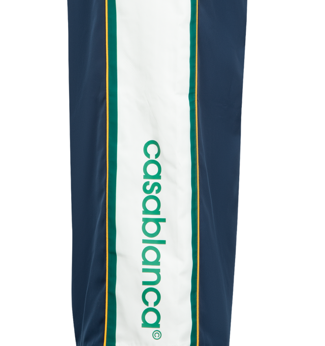 Image 4 of 4 - NAVY - CASABLANCA Track Pant featuring an elasticised waistband, drawstring fastening, slanted side pockets, stripe detail down the sides, pin-tuck seams down the front, a back pocket, and the house's Casablanca logo. Made in Portugal. 