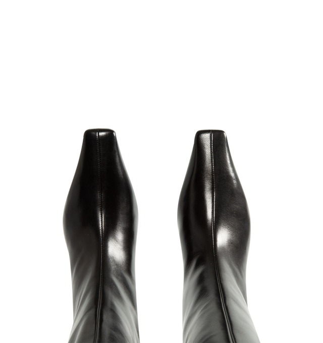 Image 4 of 4 - BLACK - Khaite Women's Knee-High Boot is crafted from smooth calfskin and features a streamlined silhouette with a modern square toe. Designed without closures for effortless pull-on wear, this Italian-made style balances clean lines with timeless versatility and is finished with a stacked heel for everyday comfort. Main Material: Calf Leather. Upper: Smooth Calfskin. Closure: Pull-On. Toe: Square. Heel Height: 5 cm / 2 in. Includes Dust Bag. Made in Italy. 