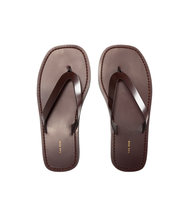 Image 4 of 4 - BROWN - The Row Refined flip flop sandal in shiny calfskin leather with stitched leather detailing and lightly treaded sole. 100% Calfskin Leather. Made in Italy. 