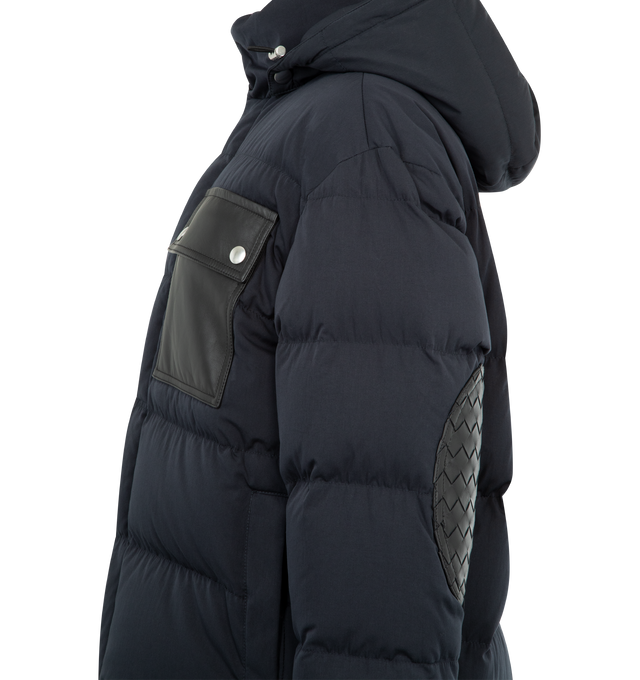 Image 4 of 4 - NAVY - Tech Cotton Puffer Jacket featuring lightweight matte tech cotton, leather pocket detail and internal special label, detachable hood, interior pinched drawstring at the waist, zipper and snap button closure, lined and relaxed fit. 79% cotton, 21% polyamide. 