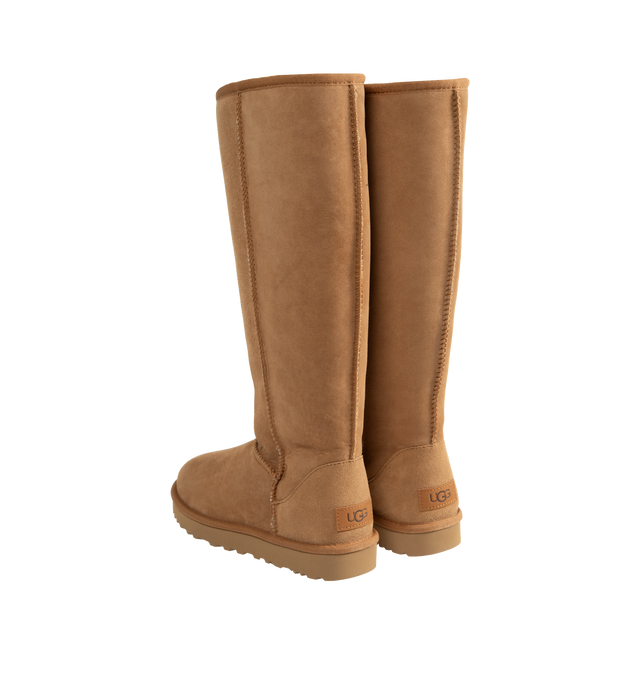 Image 3 of 4 - BROWN - Ugg Women's Classic Ultra Tall Boot is a sky-high version of the iconic style. Featuring a 15-inch shaft height, plush sheepskin lining, and an ultra-lightweight rubber outsole for comfort. Main Material: 17mm Twinface Sheepskin. Lining: 17mm Sheepskin. Insole: 17mm Sheepskin. Sole: Sugarcane EVA. Details: Overlock Stitch Seams.  