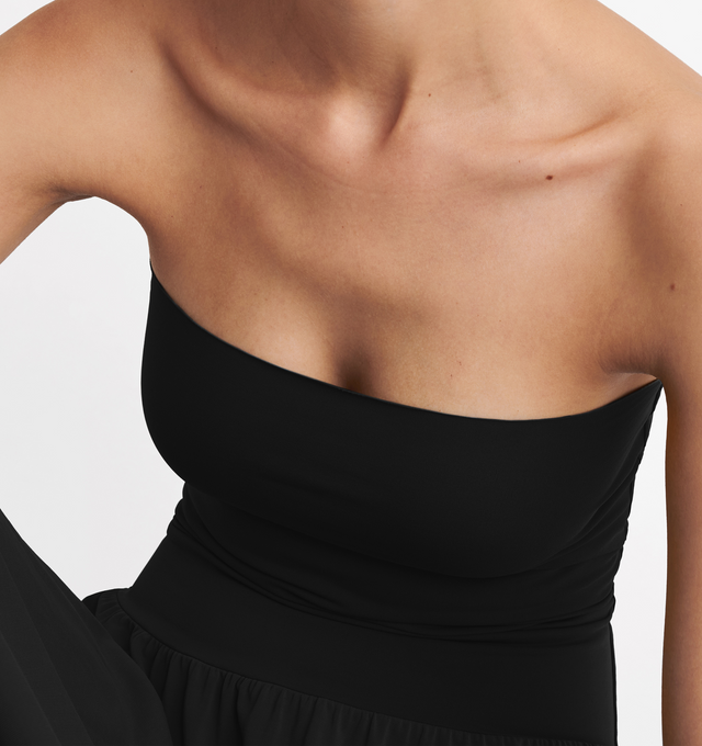 Image 5 of 5 - BLACK - ERES Oda Long Dress featuring long bustier dress with a raw edge finishing at the top and bottom that gives you the styling option to wear it as a long skirt. Main: 94% Polyamid, 6% Spandex. Second: 84% Polyamid, 16% Spandex. Made in France. 