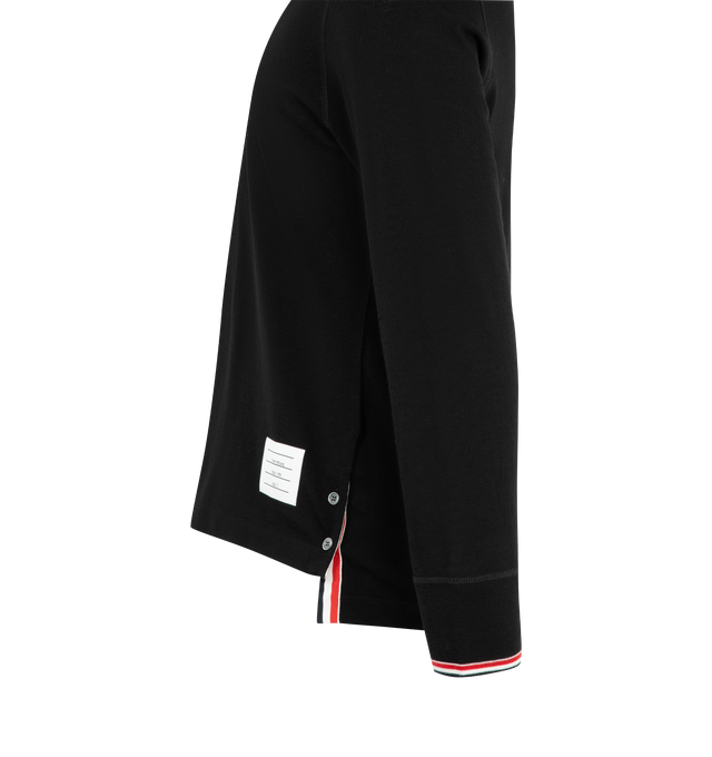 Image 3 of 3 - BLACK - Thom Browne Men's RWB Tipping Stripe Wool Jersey Henley Shirt is crafted from stretch wool jersey and features the brands signature red, white, and blue tipping stripes at the rib-knit cuffs. Designed with a classic Henley silhouette, the shirt is finished with a crewneck, long sleeves, and a button-front placket for a refined everyday look. Main Material: 96% Wool, 4% Elastane. Made in Italy. 