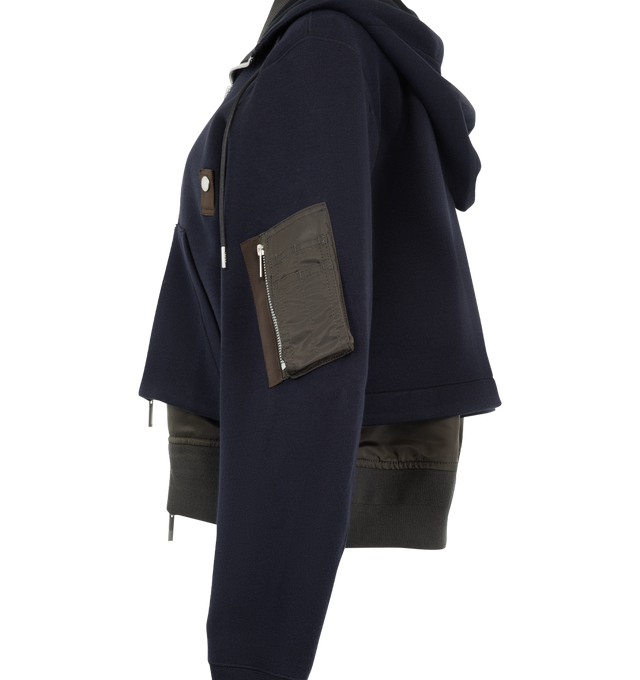Image 3 of 4 - NAVY - Sacai sponge sweat hoodie with signature layered construction, double collar, zip-front closure, drawstring hood and rib-knit stand collar. Outer material is 62% cotton / 38% polyester with 100% nylon twill panels and 100% polyester lining and filling. 