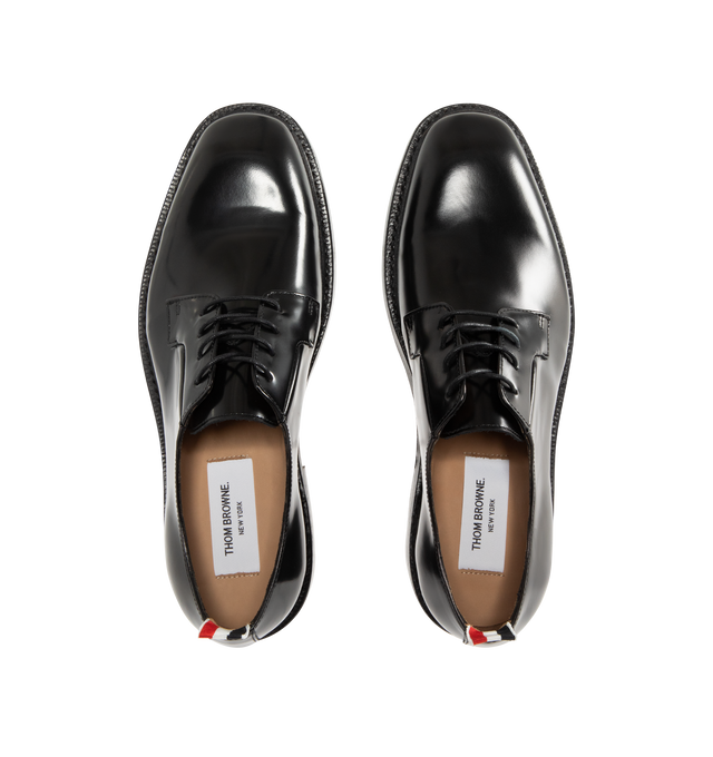 Image 4 of 4 - BLACK - THOM BROWNE Soft Spazzolatio Blucher Shoe featuring soft spazzolato leather with a high-shine finish, nipped toe, lace-up closure, Goodyear-welted leather sole with rubber heel insert, metal taps on heels and signature striped grosgrain loop tab. 100% calf leather. Made in Italy. 