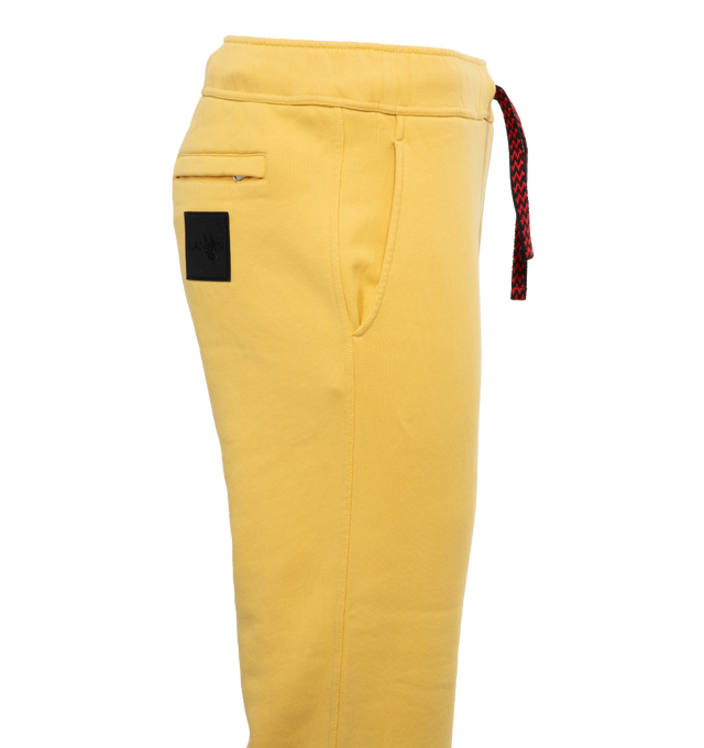 Image 2 of 3 - YELLOW - LANVIN LAB X FUTURE Logo Sweatpants featuring cotton fleece joggers with Curb drawstrings, ribbing on the waist and ankles, relaxed fit and embroidered logo on leg. 100% cotton. 