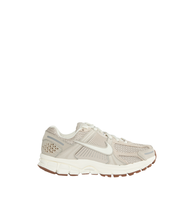 NEUTRAL - NIKE Zoom Vomero 5 featuring a mesh base, suede and leather overlays, plastic lace cage and heel counter, 3M reflective detailing, The Cushlon and Zoom Air-cushioned midsole, along with the Gum rubber outsole, provide durability and traction.