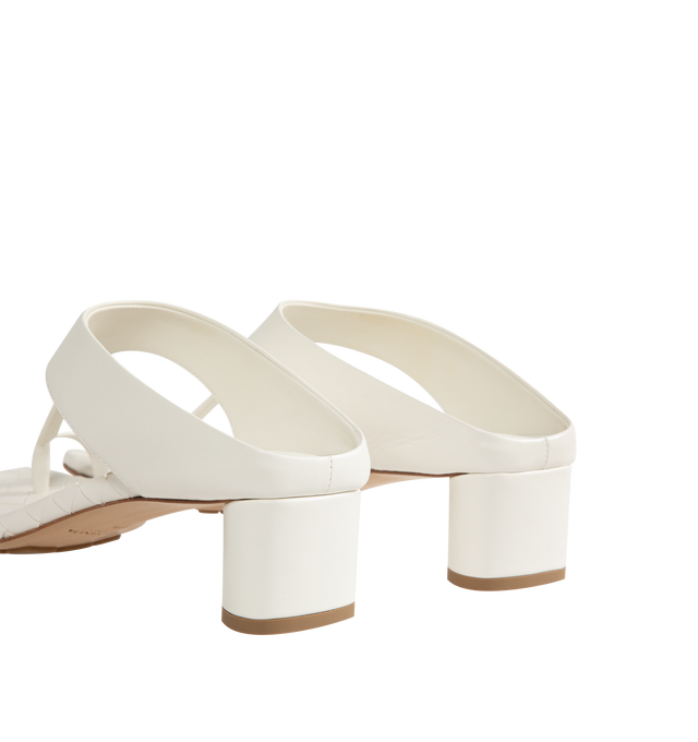 Image 3 of 4 - WHITE - Bottega Veneta Womens Kitten Heel Thong Sandals are crafted from nappa leather. Feature a toe-ring leather strap, Intrecciato leather insole, lambskin lining, kitten heel, and rubber-injected leather outsole. Upper: Nappa Leather; Lining: Lambskin; Outsole: Rubber-Injected Leather. Made in Italy. 