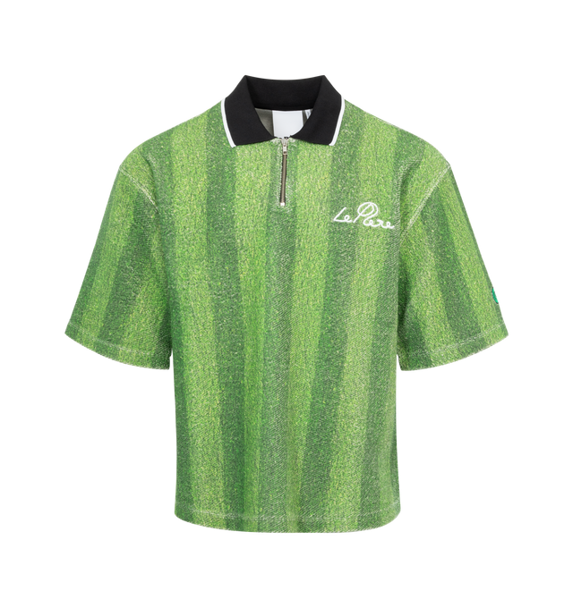 Image 1 of 2 - GREEN - La Pere Astro half-zip polo recreates the quintessential turf from grass football pitches printed on the inside of an Italian sweatshirt cotton fabric. Features an embroidery of 'le PRE' in cursive on the left chest. 100% cotton.  Made in Portugal. 