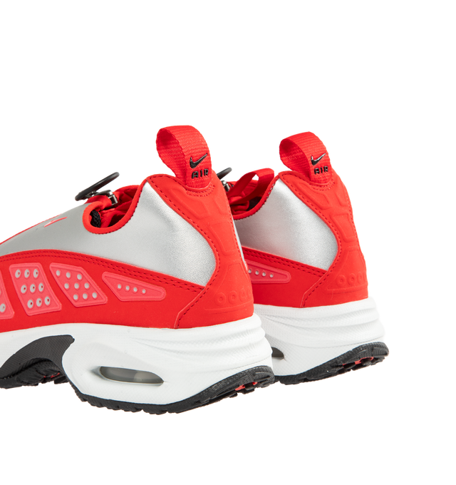 Image 3 of 5 - RED - NIKE Air Max SNDR Sneaker featuring Air cushioning in the heel and forefoot for exceptional bounce and comfort, unzip the shroud to reveal "6453," waterproof GORE-TEX fabric, reflective panels, foam midsole and rubber outsole. 