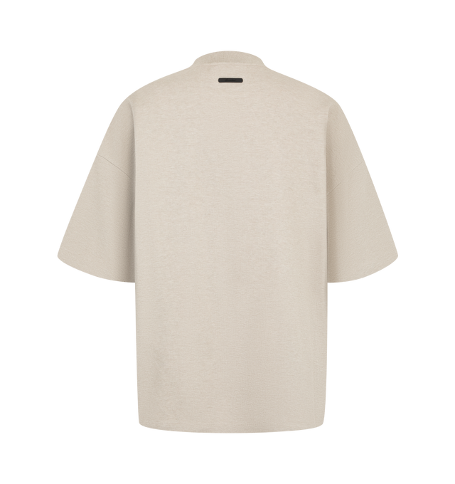 Image 2 of 2 - NEUTRAL - Fear of God ESSENTIALS Men's Signature 90s Relaxed Tee is crafted from a medium-weight cotton-blend pique knit and features an oversized 90s-inspired silhouette with dropped shoulders and relaxed proportions. Designed with minimalist branding, this elevated everyday essential is finished with an embroidered signature logo at the front, a rib-knit crew neckline, and a signature label at the back collar. Main Material: 80% Cotton, 20% Polyester, 265 GSM.  