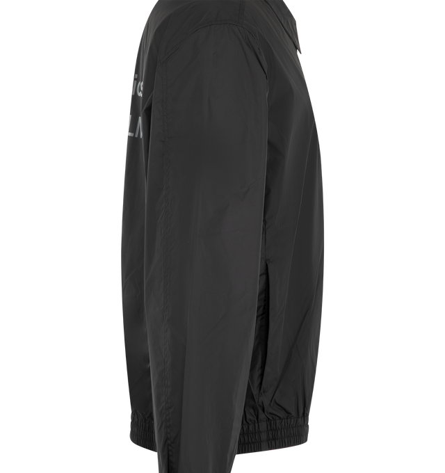 Image 3 of 3 - BLACK - Acne Studios Mens Nylon Jacket is crafted from lightweight recycled nylon with a semi-shiny finish. Features a regular fit, below-waist silhouette, pointed collar, front zip closure, side-seam pockets, elasticized cuffs and hem, full lining, and Acne Studios 1996 logo at the back. Main Material: 100% Nylon; Lining: 55% Polyester, 45% Viscose. Made with recycled nylon and recycled polyester/FSC-certified viscose lining. Made in Portugal. 