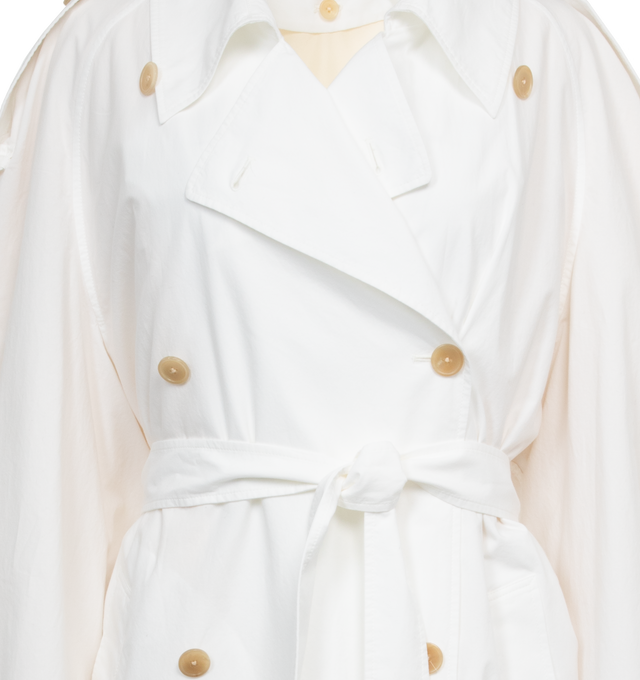 Image 3 of 4 - WHITE - THE ROW Denver Coat featuring calf-length, doubled-breasted trench coat in vintage cotton with raglan sleeves, buttoned shoulder epaulettes, removable belt, horn button closure, side welt pockets and removable liner. 100% cotton. Made in Italy. 