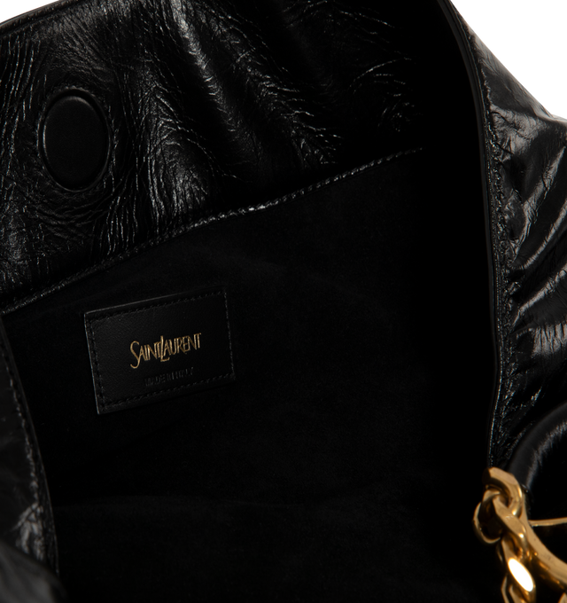 Image 4 of 4 - BLACK - Saint Laurent Womens Hobo Bag is crafted from lustrous calfskin leather. Features a slouchy silhouette, signature Cassandre ring detail, shoulder strap, magnetic closure, removable zip pouch, suede lining, and bronze-tone hardware. Main Material: Calfskin Leather; Lining: Suede; Hardware: Brass. Made in Italy. 