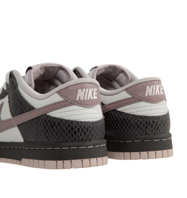 Image 3 of 5 - BROWN - Nike Dunk Low SE Sneakers are a lace-up style with a low-cut collar, foam midsoles, rubber outsoles, and grippy soles.  