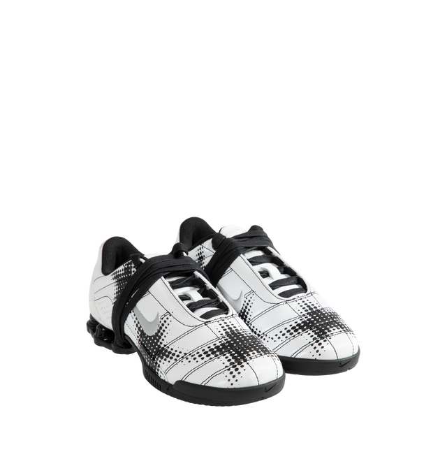 Image 2 of 5 - WHITE - Nike Women's Total 90 Shox Magia Sneakers feature a premium nubuck leather upper with oversized laces and printed graphic detailing, combining the iconic design of the Total 90 with a sleek, tonal finish. Inspired by early-2000s soccer style, these lifestyle sneakers pair signature Nike Shox cushioning with a durable rubber outsole for responsive comfort and everyday wear. Main Material: Nubuck Leather. Midsole: Nike Shox. Sole: Rubber.  