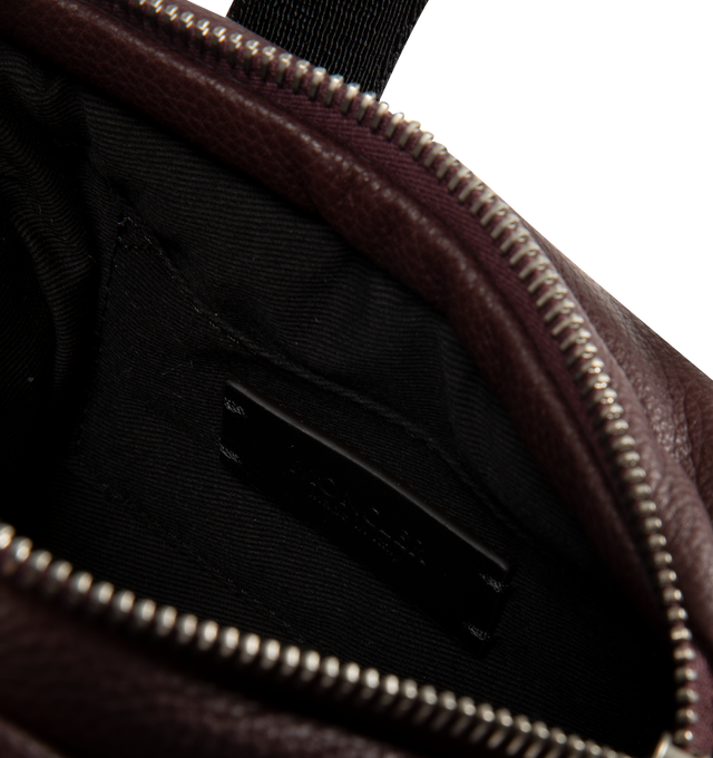 Image 3 of 3 - RED - Moncler Womens Micro Caradoc Shoulder Bag is crafted from leather exterior with signature horizontal boudin quilting. Features cotton drill lining, padded construction, ribbon top handles with leather grip, adjustable and detachable leather shoulder strap, zip closure, and metal Moncler logo. Lining: 100% Cotton; Padding: 90% Down, 10% Feather; Leather Exterior: Cow Leather. Dimensions: 16.5cm L x 13cm H x 8cm D. Made in Italy. 