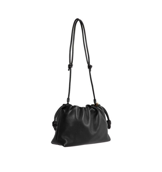 Image 2 of 3 - BLACK - LOEWE Flamenco Purse crafted in mellow nappa lambskin in a ruched design featuring knots at the sides, magnetic closure and detachable donut chain. Versatile and functional, it can be carried as a clutch, worn over the shoulder using the donut chain or crossbody with the accompanying leather strap.  Nappa leather with suede lining. Height 7.9" X Width 11.8" X Depth 4.1". Adjustable Strap length (inches) 37" to 47". Made in Spain. 