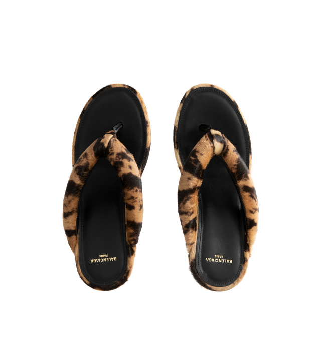 Image 4 of 4 - MULTI - Balenciaga Womens Gaeta Wedge Thong Sandals are crafted from ocelot-print calf hair. Feature a round toe, padded thong strap, slip-on design, wedge heel, and leather sole. Main Material: 100% Calf Hair Leather; Sole: Leather. Made in Italy. 