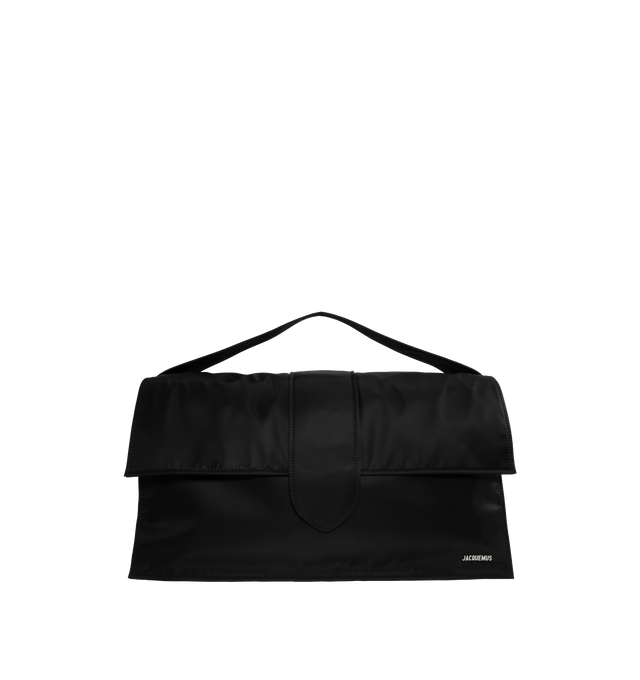 BLACK - JACQUEMUS Le Bambino De Voyage Duffle Bag featuring carry handle, adjustable and detachable webbing shoulder strap, logo hardware at face, patch pocket at back face, foldover flap, magnetic closure, zip closure, zip pocket at interior and logo-engraved silver-tone hardware. H11 x W23.5 x D7 in. Cotton twill lining. Made in Italy.