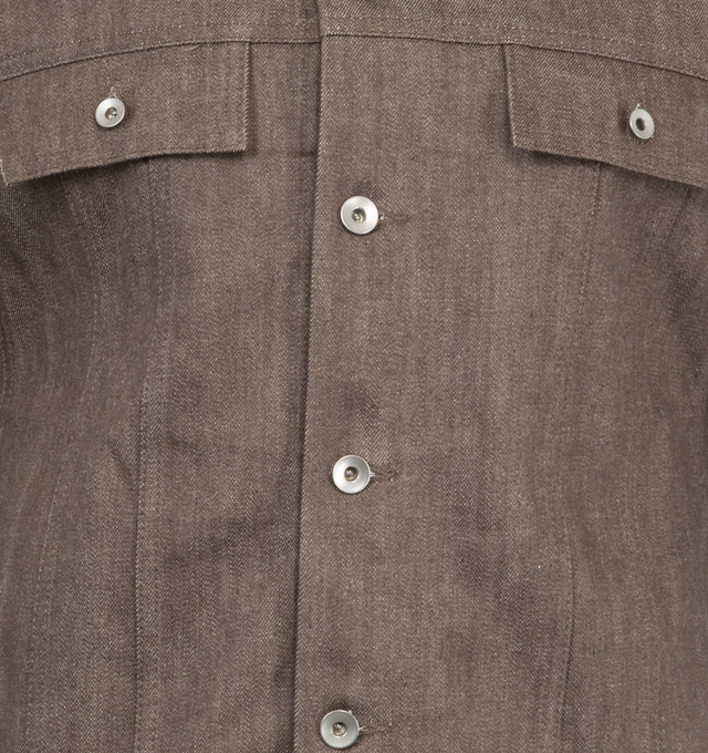 Image 3 of 3 - BROWN - Dark Shadow Trucker Jacket has a classic collar, a front button closure, button cuffs, side pockets, chest flap pockets with buttons, and waist tabs. 100% cotton Made in Japan.  