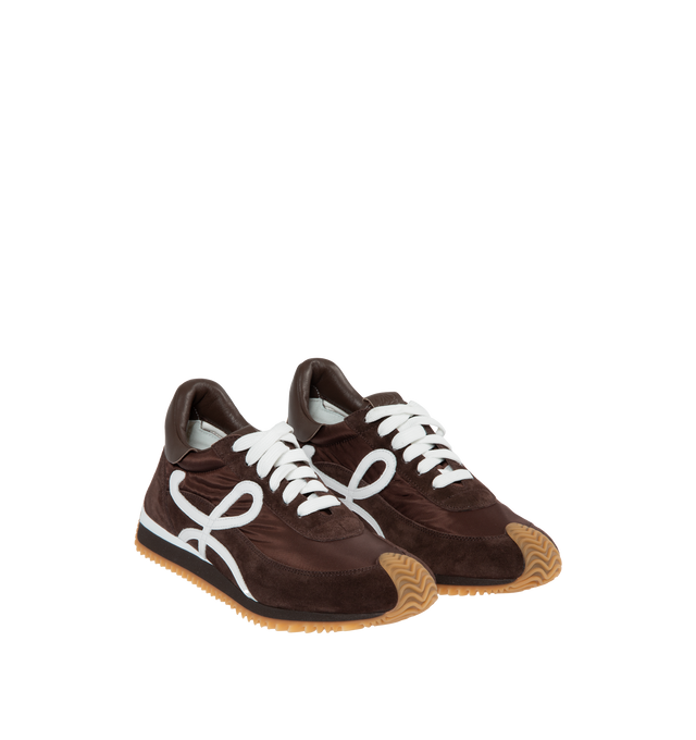 BROWN - Loewe Flow lace-up runner in  suede calfskin and nylon, featuring an L monogram on the quarter. The textured honey-coloured rubber outsole extends to the toe-cap and on to the back of the heel. Gold embossed LOEWE logo on the backtab. Made in: Italy.