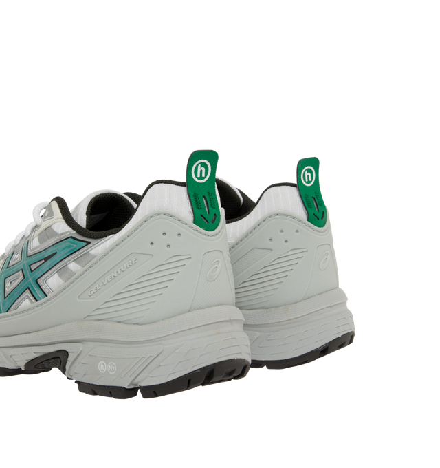 Image 3 of 5 - WHITE - Asics Hidden Nygel-Venture 6 Shield Sneakers are a lace-up style with rip stop mesh, reflective accents, clear laces, rearfoot GEL technology, and a trail-specific traction pattern.  