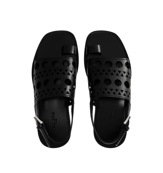 Image 4 of 4 - BLACK - Alaia Perforated Flat Sandals have rounded square toes, ankle straps with buckle closures, toe straps, leather soles, and perforated leather uppers. Made in Italy.  