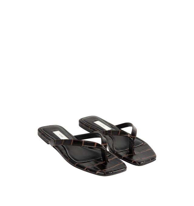 Image 2 of 4 - BROWN - Toteme Women's Croco-Embossed Flip-Flops are crafted from croc-embossed leather and feature a minimalist thong silhouette with an open square toe. Designed with a padded sheepskin footbed featuring a subtle logo patch, these designer sandals are finished with a calfskin leather sole for a refined take on an everyday warm-weather essential. Part of Toteme's Garderob collection. Upper: Leather. Footbed: Sheepskin. Sole: Calfskin Leather. Color: Dark Brown. Made in Italy. 