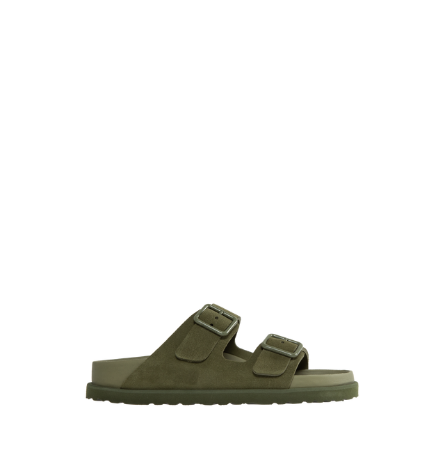 Image 1 of 4 - GREEN - Birkenstock's Arizona sandals in a narrow width. The iconic Arizona sillhouette is  updated in suede featuring adjustable straps with buckle closures, logo details, shaped insole, and EVA outsole. Upper: Luxurious fine flesh out suede, a full grain leather that has been flipped to use the fuzzy side. Footbed: Anatomical shaped BIRKENSTOCK cork-latex footbed, covered with premium, color-matching smooth nappa leather. Sole: EVA outsole with a 3mm EVA welt updates the standard die-cut ou