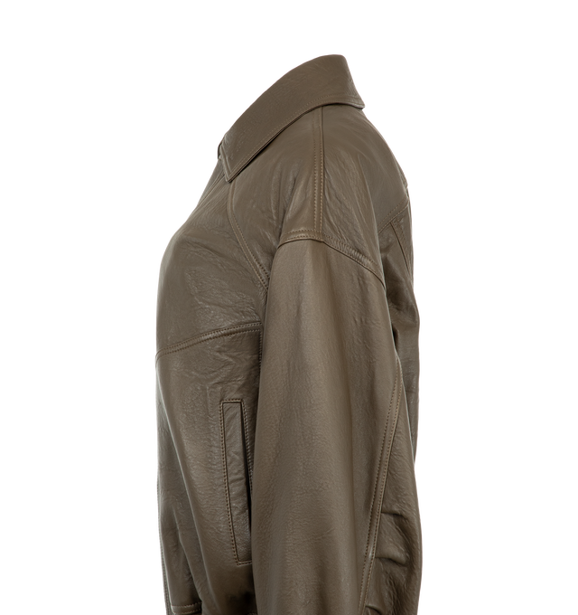 Image 4 of 4 - BROWN - Saint Laurent Women's Ranch Lambskin Bomber Jacket is crafted from supple lambskin leather and features a pointed collar, dropped shoulders, and an elasticized waist. A front zip closure with a snap-button storm flap, two front patch pockets, an interior welt pocket, and snap-button cuffs complete the design. Main Material: 100% Lambskin Leather. Lining: Cotton. Made in Italy. This item may be restricted for online purchase to international clients. For assistance purchasing this item 