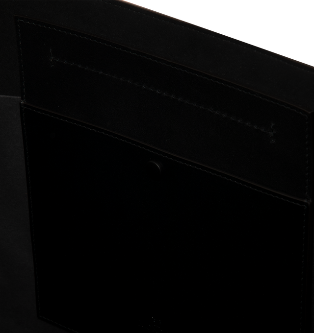 Image 3 of 3 - BLACK - Moncler Men's Carlo Leather Tote Bag is crafted from supple calf leather and features a spacious, clean-lined silhouette designed for versatile everyday use. Finished with adjustable leather handles, an interior pocket with snap-button closure, embossed and metal Moncler logo details, and a stretch polyester-blend lining, this designer tote combines refined craftsmanship with practical organization. Leather Exterior: Cow Leather. Lining: 91% Polyester, 9% Elastane/Spandex. Dimensions: 