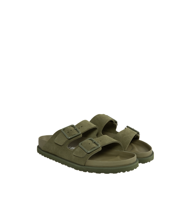 Image 2 of 4 - GREEN - Birkenstock's Arizona sandals in a regular width. The iconic Arizona sillhouette is  updated in suede featuring adjustable straps with buckle closures, logo details, shaped insole, and EVA outsole. Upper: Luxurious fine flesh out suede, a full grain leather that has been flipped to use the fuzzy side. Footbed: Anatomical shaped BIRKENSTOCK cork-latex footbed, covered with premium, color-matching smooth nappa leather. Sole: EVA outsole with a 3mm EVA welt updates the standard die-cut o 