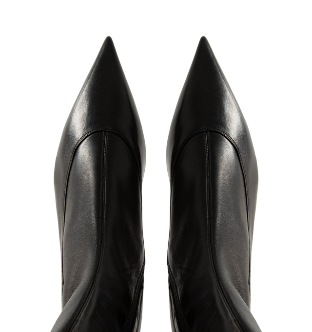 Image 4 of 4 - BLACK - Khaite Women's Valerie Mid-Calf Boots are crafted from black stretch nappa lambskin selected for its soft patina and flexibility. The close-fitting silhouette features an elongated pointed toe, sculpted lines, a curved heel integrated into the leather sole, and a side zipper closure. Upper: 100% Lambskin. Sole: 100% Calfskin. Heel Height: 5.5 cm / 2.2 in. Made in Italy. 