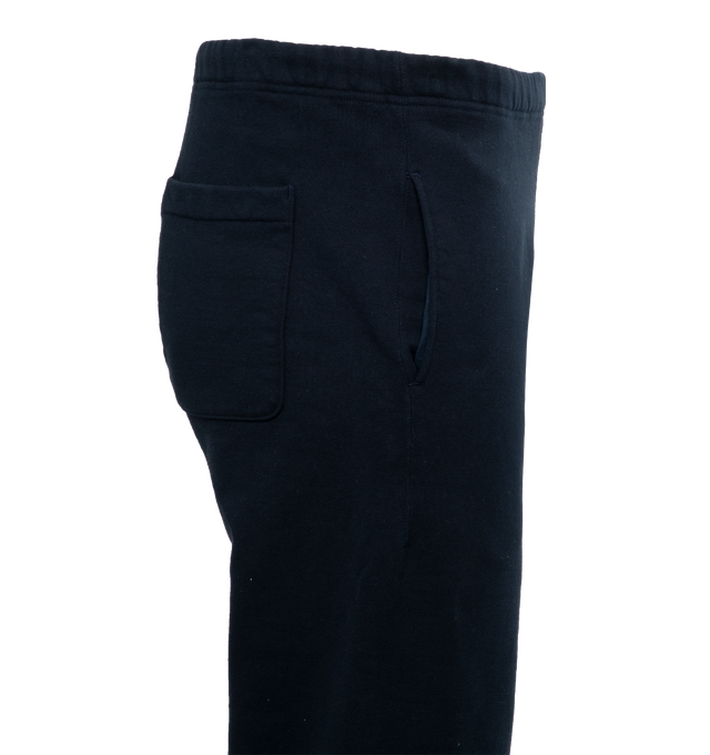 Image 3 of 4 - NAVY - HUMAN MADE Sweatpant featuring elastic waist and hems, side pockets, one back patch pocket and branding on leg. 100% cotton. 