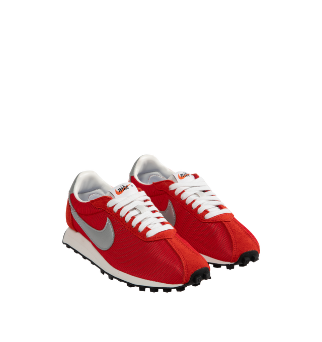 Image 2 of 5 - RED - Nike LD-1000 Sneakers are a lace-up style with removable and cushioned insoles, textile and leather uppers, flared heels, waffle treads, and rubber soles.  