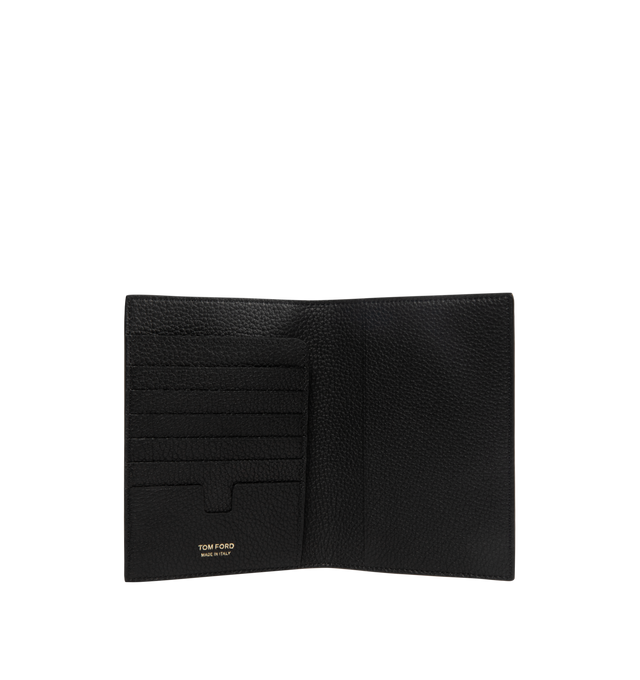 Image 3 of 3 - BLACK - TOM FORD Soft Grain Leather T Line Passport Holder featuring pebble-grained calfskin passport holder, gold-tone logo stamp at face, six card slots at interior, two passport slots and canvas lining. H5.75" x W4" x D1". Calfskin. Made in Italy. 