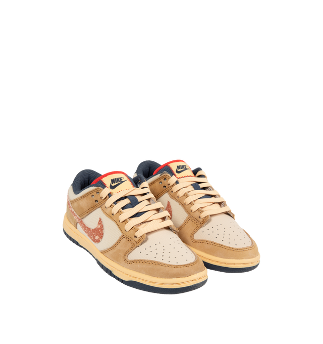 Image 2 of 5 - NEUTRAL - Nike Dunk Low Sneakers with Wheat, Burnt Sunrise and Sanddrift color-blocking,  a padded, low-cut collar, leather upper with a slight sheen and durability, foam midsole offering lightweight, responsive cushioning. Perforations on the toe add breathability. Rubber sole with classic hoops pivot circle provides durability and traction. 