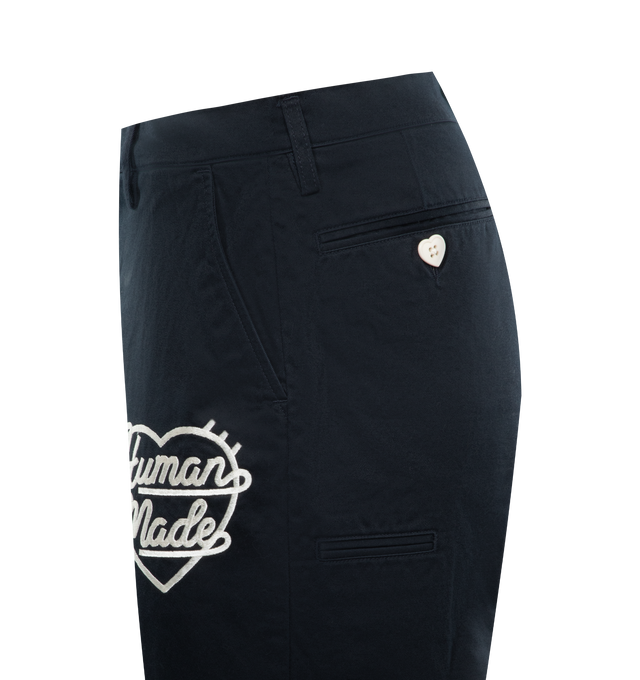 Image 3 of 3 - NAVY - HUMAN MADE Chino Pants featuring wide fit, zip fly, original logo tack buttons, straight leg with front pleat, tonal embroidered logo on the thigh, two hand pockets, four welt pockets on the back and turn-up hems. 100% cotton. 