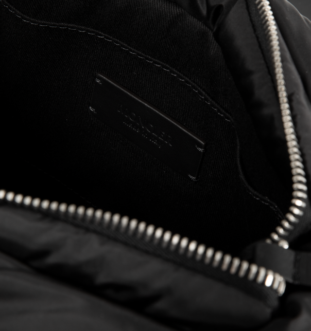 Image 3 of 3 - BLACK - MONCLER Caradoc Water-Repellent Mini Tote Bag featuring water-repellent nylon, nylon drill lining, down-filled, ribbon handles with leather grip, adjustable and detachable leather shoulder strap, zipper closure and metal logo. L 30 cm x H 20 cm x D 13 cm. 100% polyamide/nylon. Lining: 95% cotton, 5% acrylic. Padding: 90% down, 10% feather. 