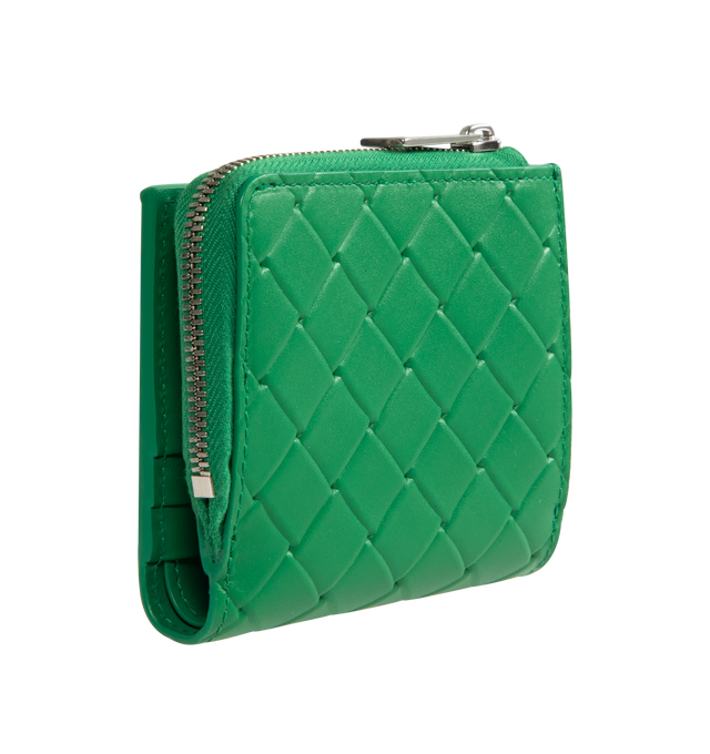 Image 2 of 3 - GREEN - BOTTEGA VENETA Bi-Fold Wallet in calf leather with embossed Intrecciato pattern featuring six card slots, one bill compartment, one zippered coin purse and press stud closure. Calfskin. Made in Italy. 