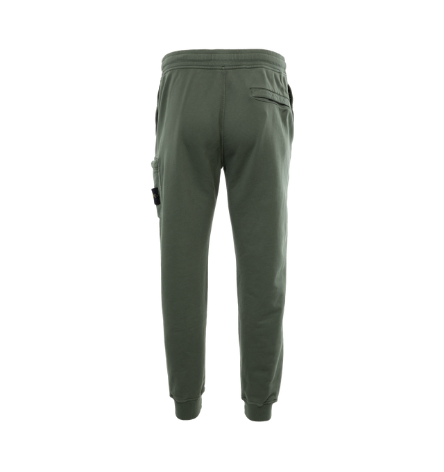 Image 2 of 4 - GREEN - STONE ISLAND Cargo Sweatpants featuring in-seam pockets, one back pocket with hidden snap fastening, patch pocket on the left leg featuring the Stone Island badge, hidden zipper closure, elasticized waist with outer drawstring, ribbed leg bottoms and zipper closure. 100% cotton. 