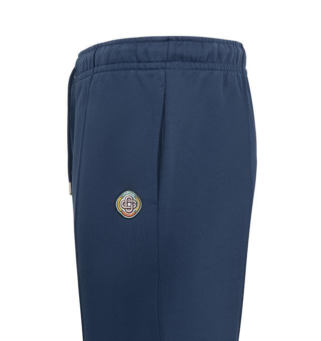 Image 3 of 3 - BLUE - CASABLANCA Loopback Patch Open Hem Jogger featuring a flared leg, open hem, signature CC patch, elasticated drawstring waistband, center seams, 2 side pockets and woven brand patch. 100% organic cotton. Made in Portugal. 